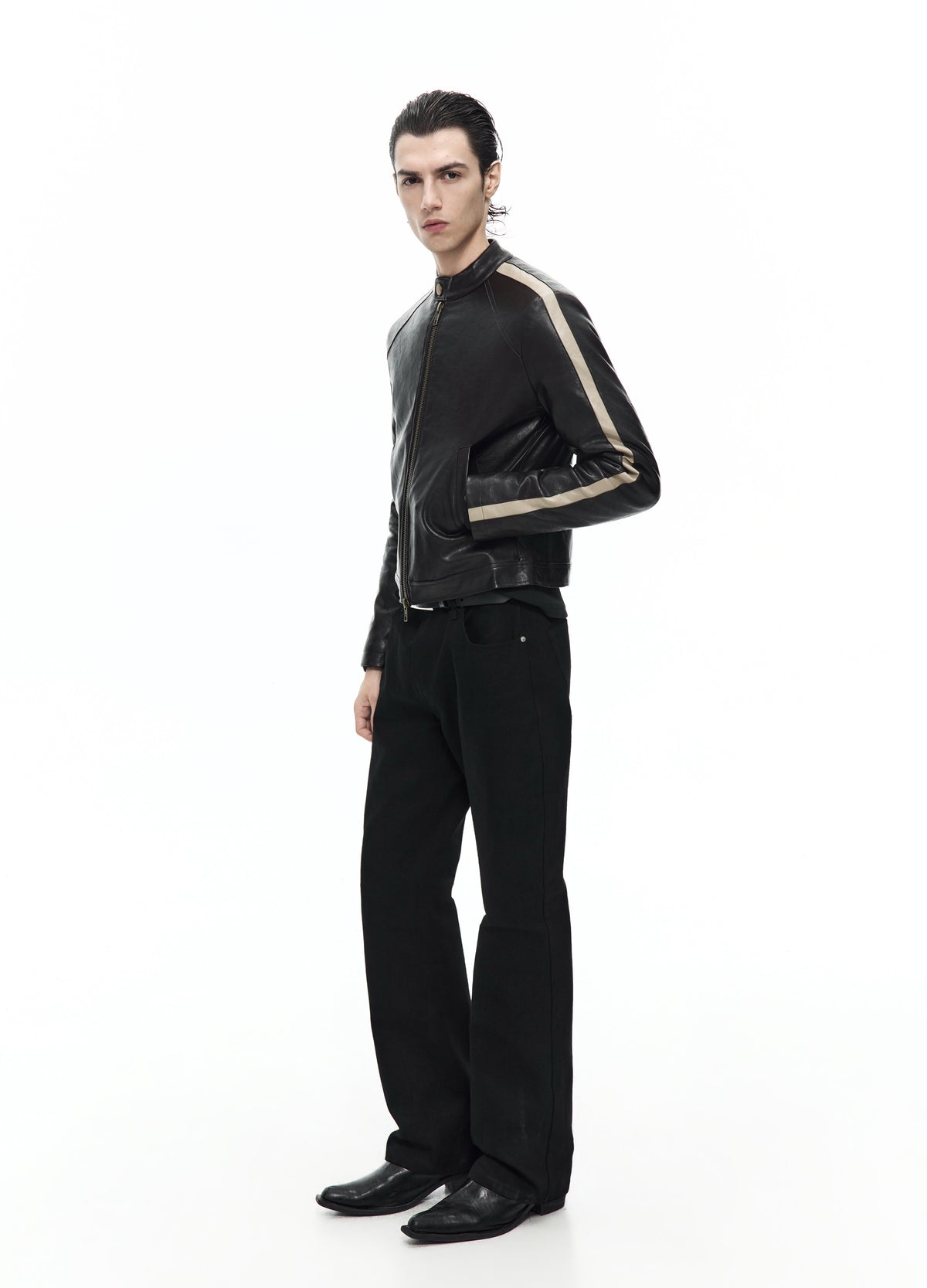 Side view of the zipped dark brown jacket, showing a pale stripe running from the shoulder down the sleeve.