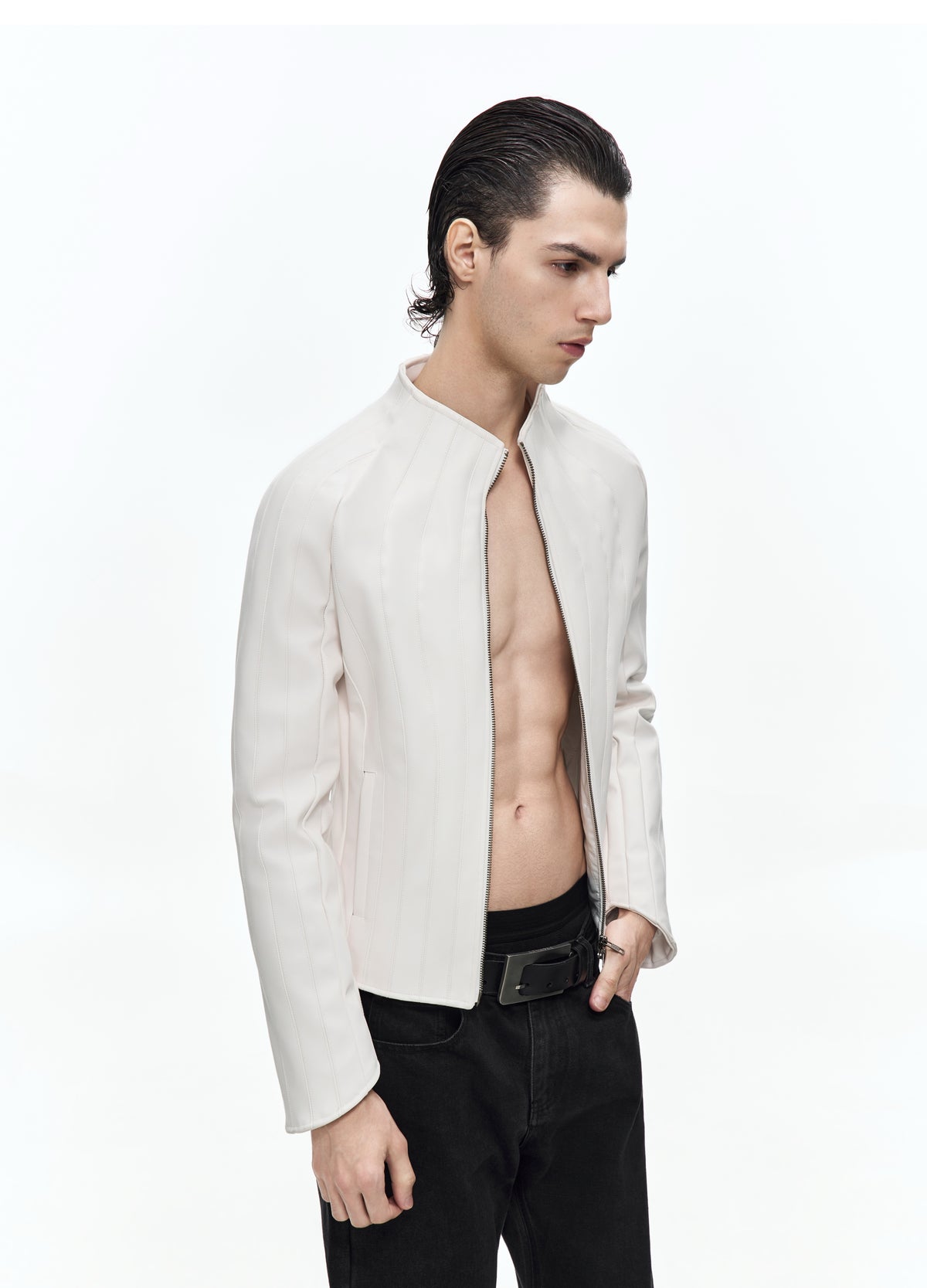 Closer three-quarter view of the open off-white jacket, showing the curved front seams, stand collar and short hem.