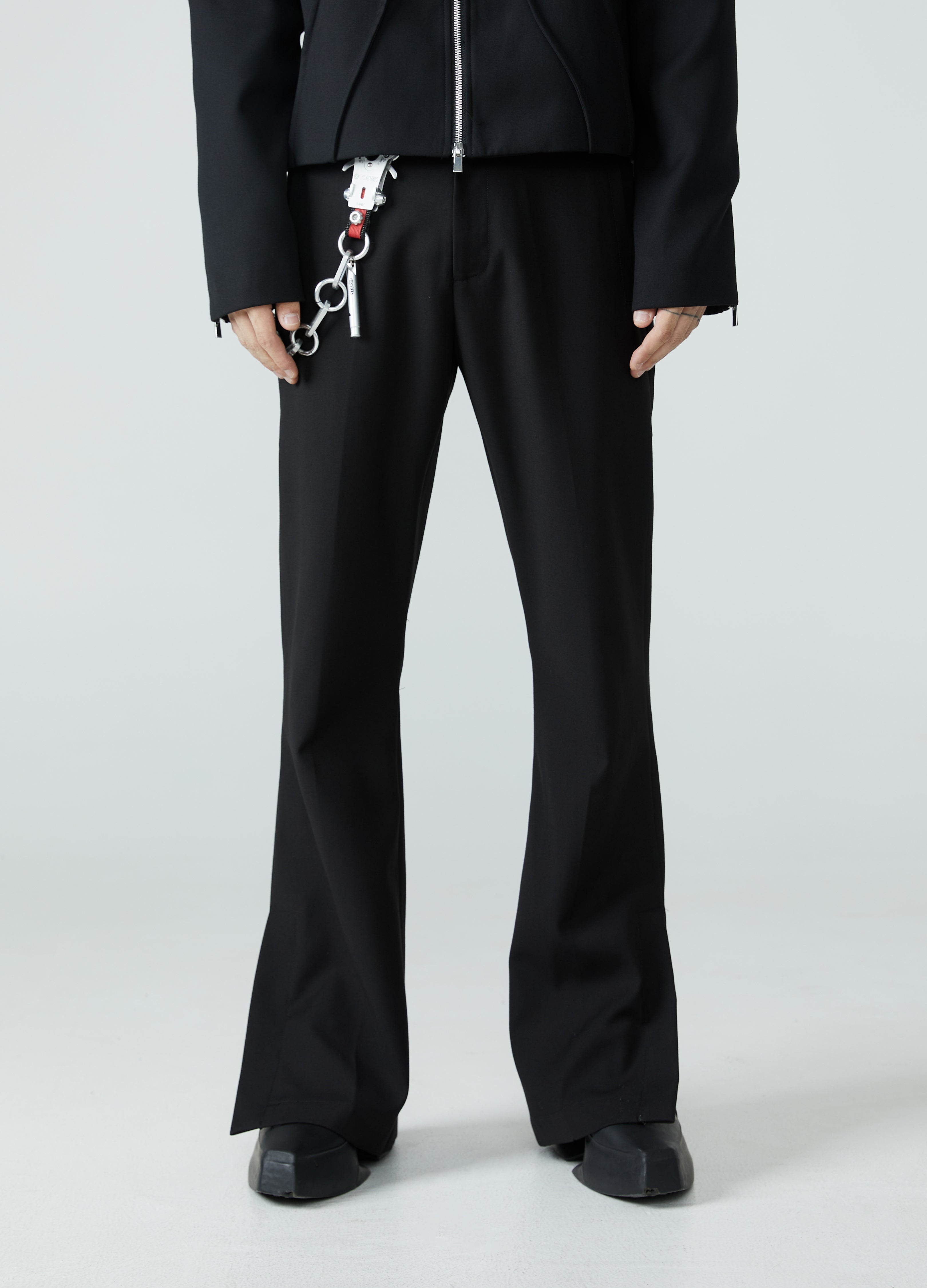 Pantaloni con spacchi e orlo a micro-stivale 23FW