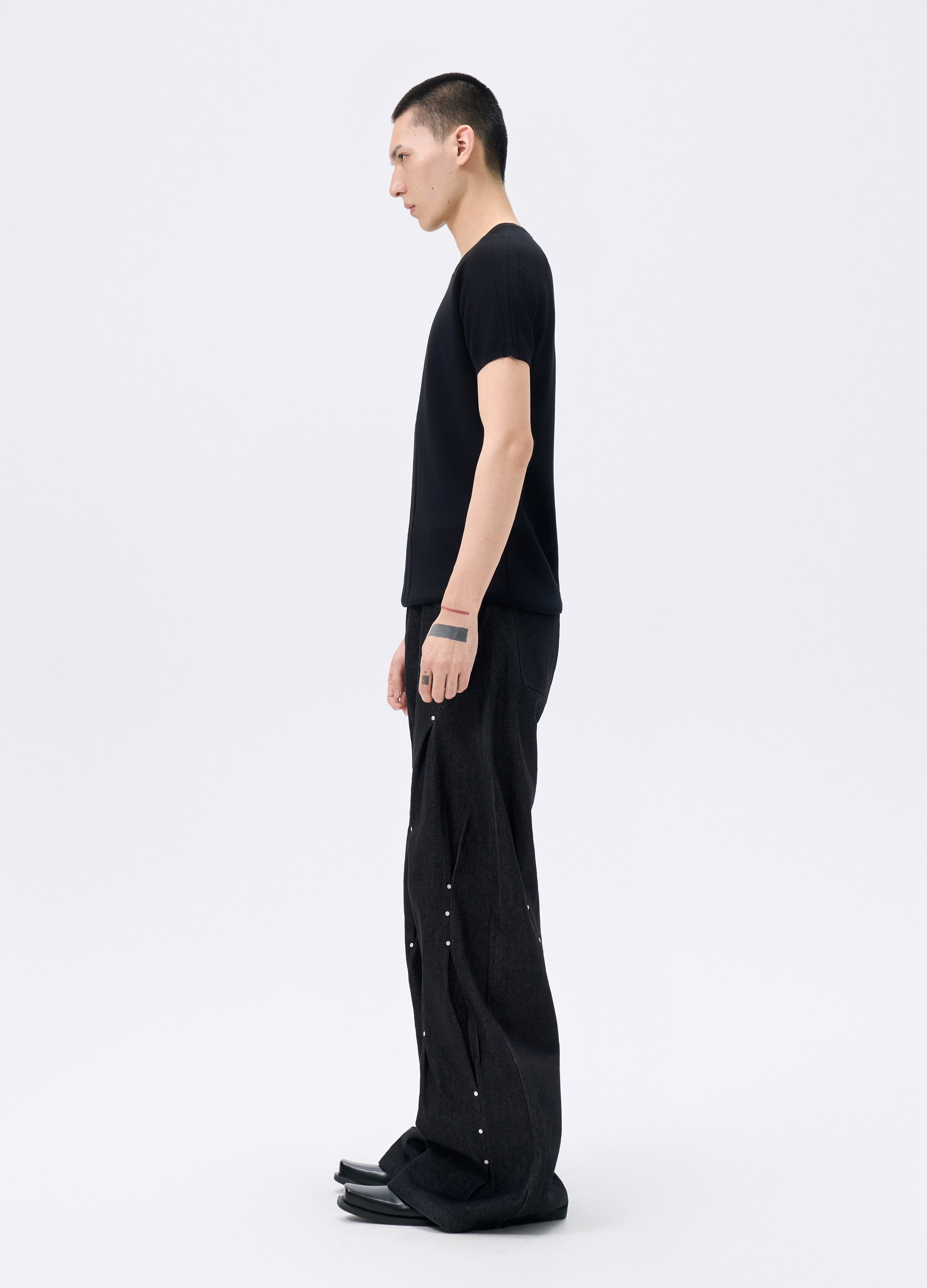 25FW STUDDED TWISTED DENIM TROUSERS