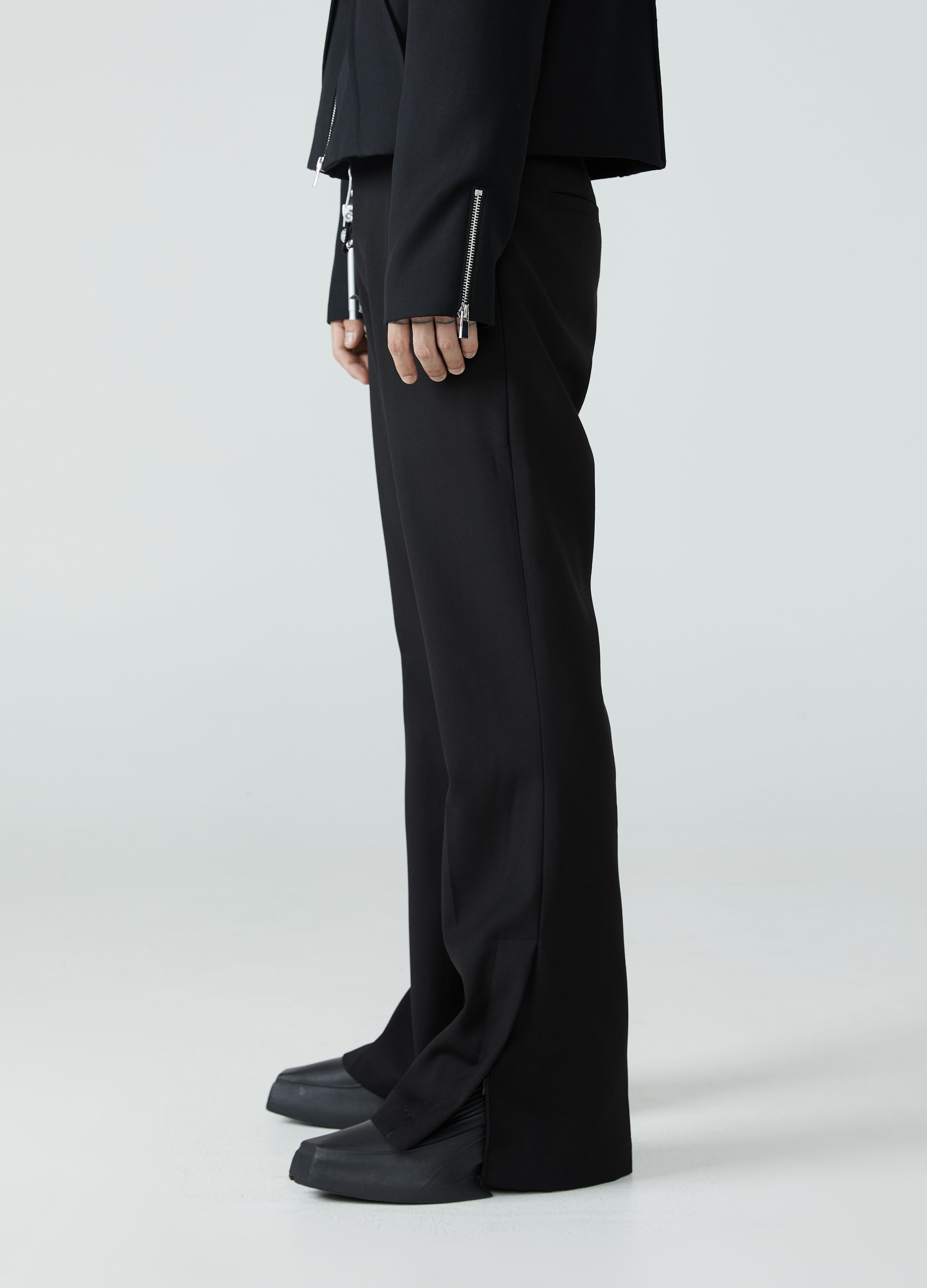 Pantaloni con spacchi e orlo a micro-stivale 23FW