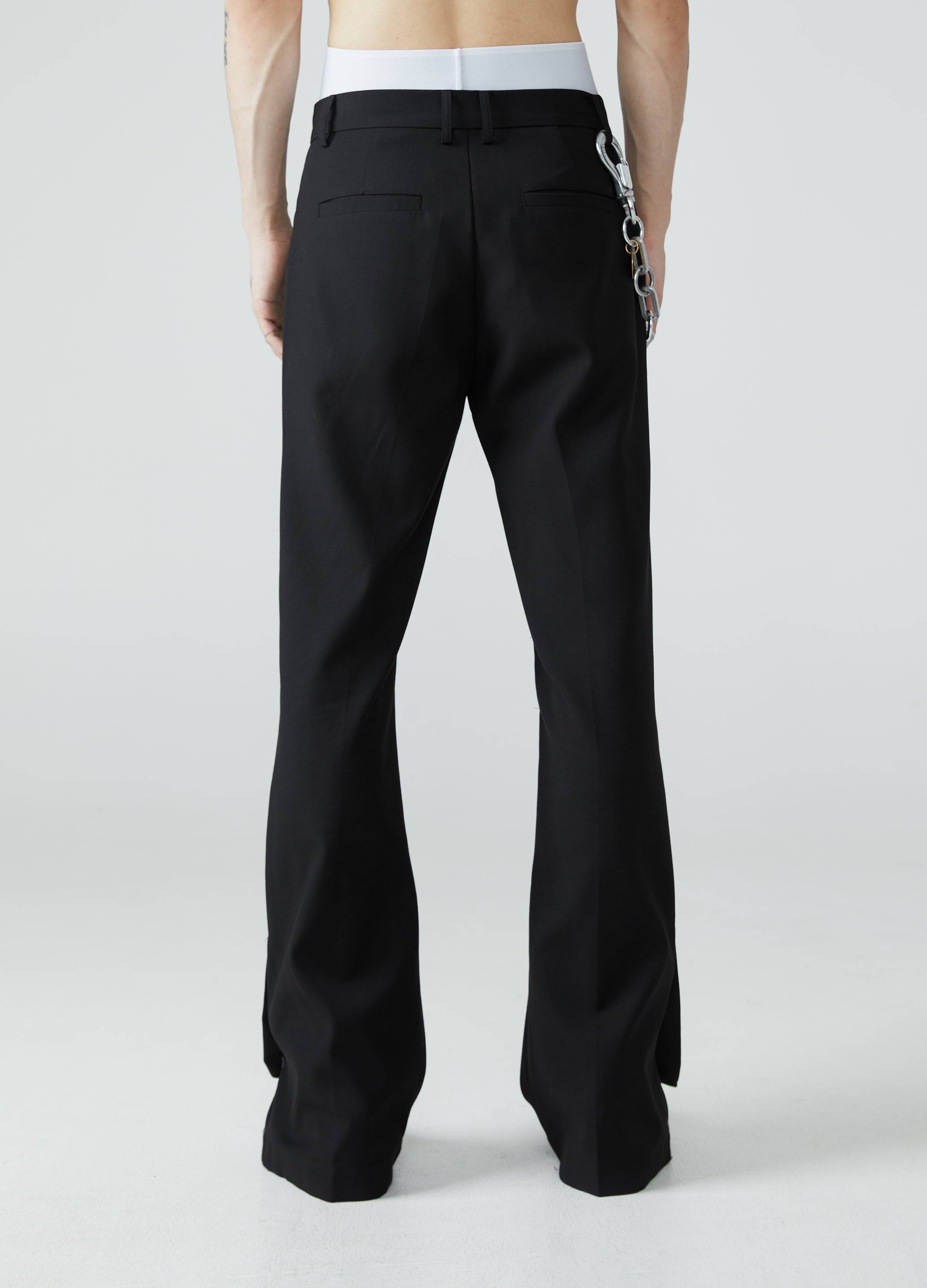 Pantaloni con spacchi e orlo a micro-stivale 23FW