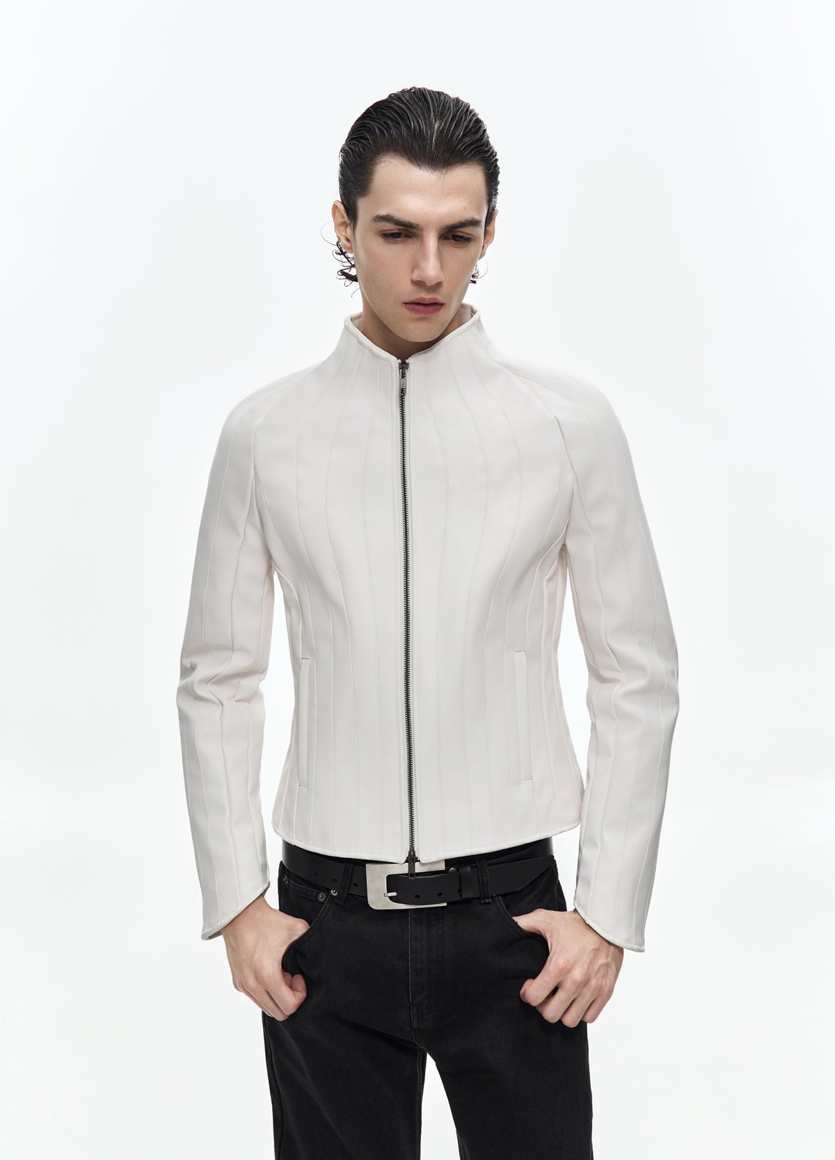 Closer front view of the zipped off-white jacket, showing the stand collar, narrow waist, curved vertical seams and slit pockets.