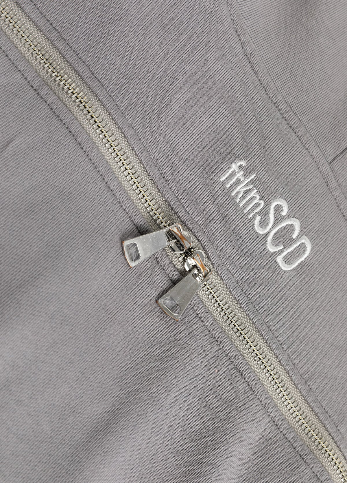 Upper-back zip pulls and embroidered logo.