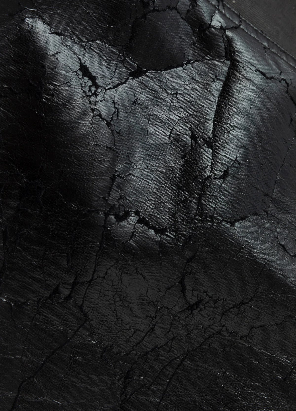 Cracked glossy panel surface.