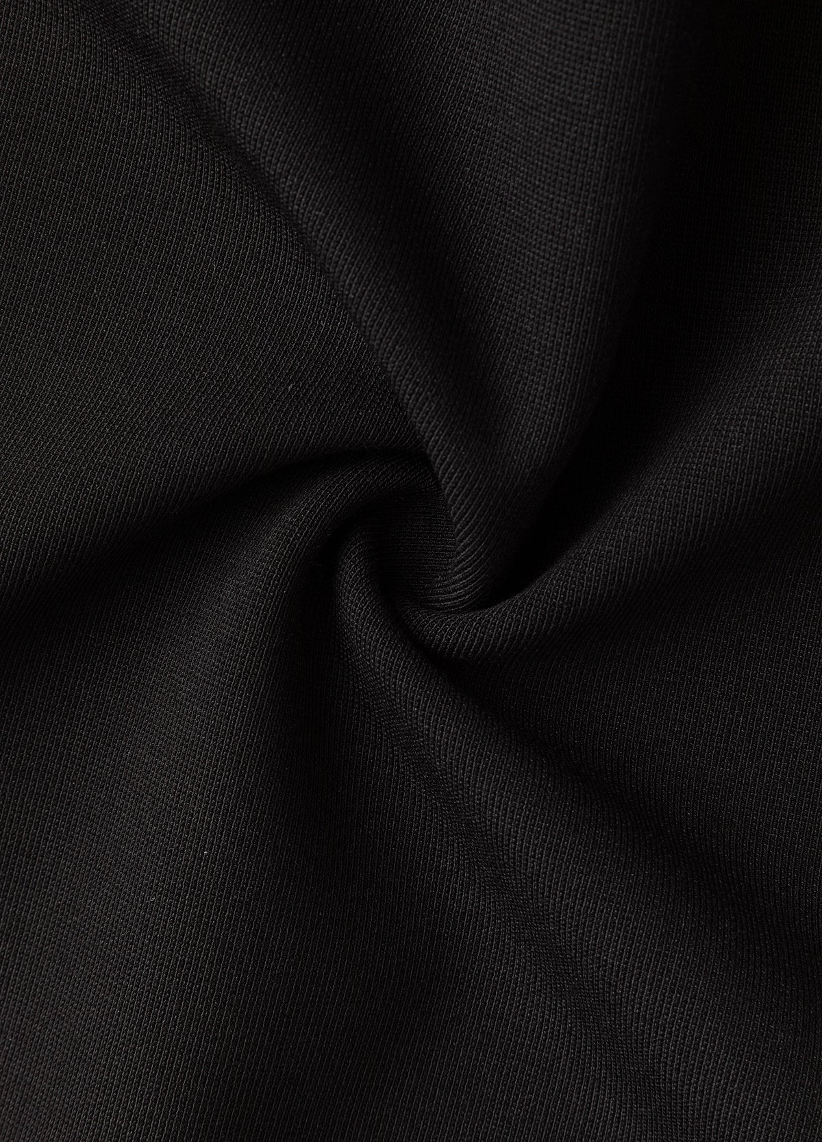 Black fabric surface.