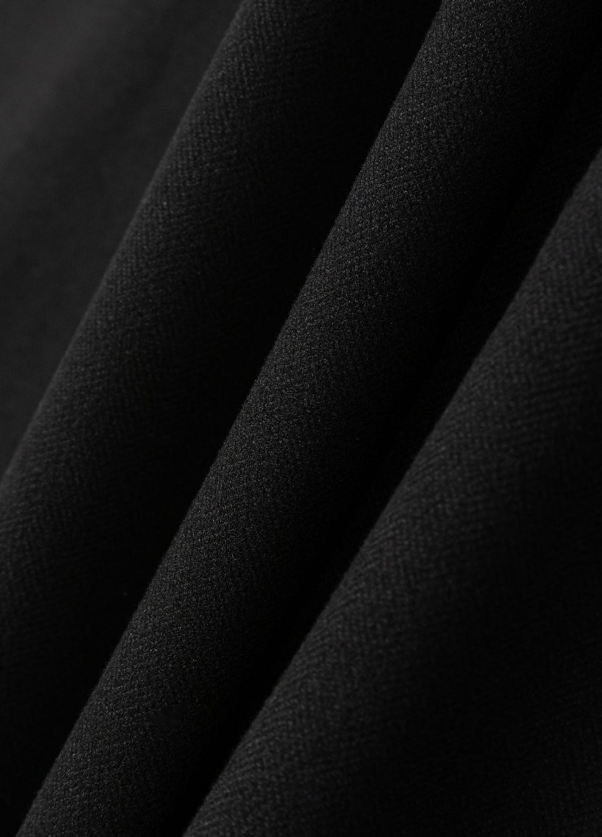 Black fabric surface.