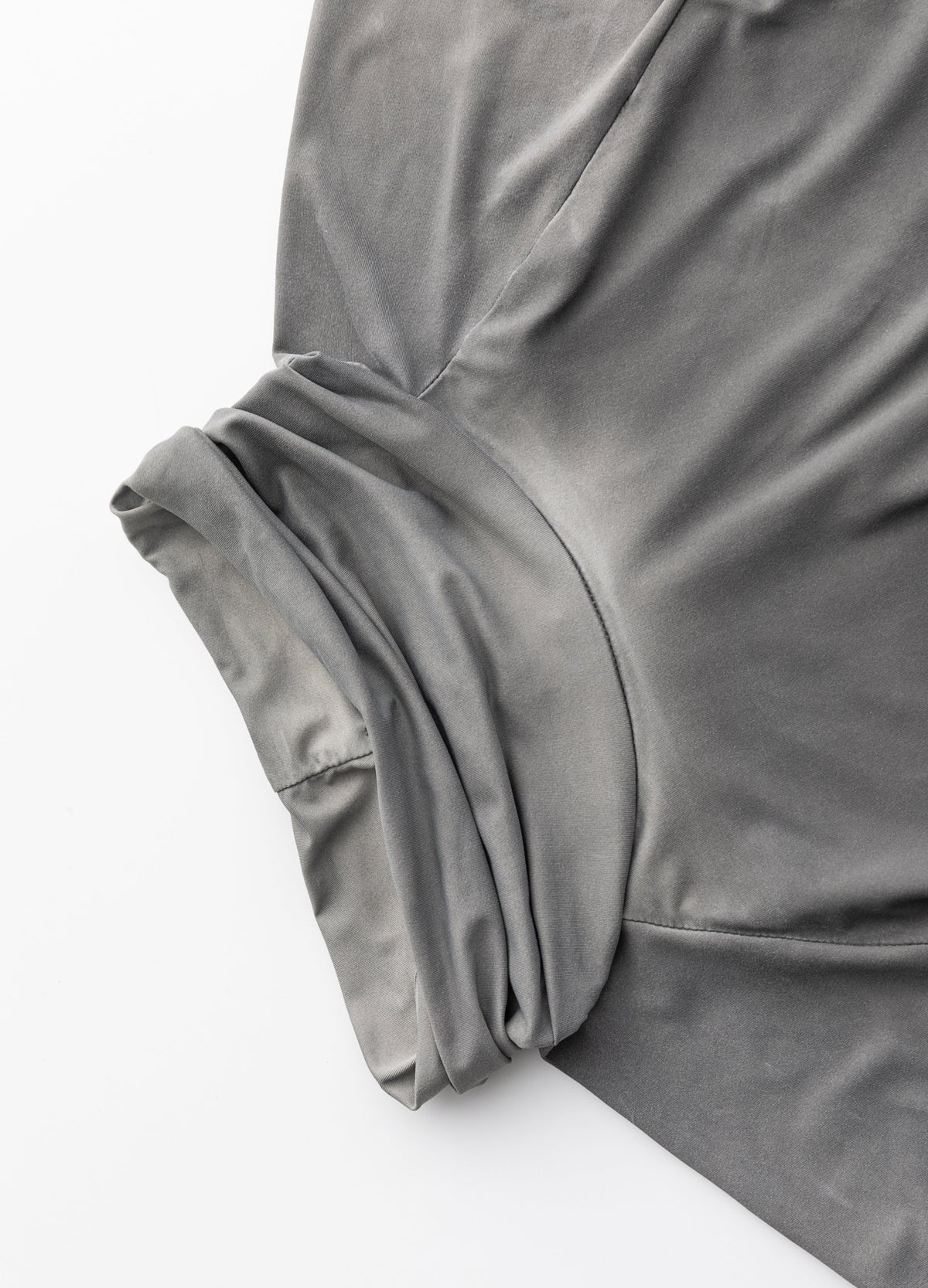 Gathered high neckline and raglan seams.