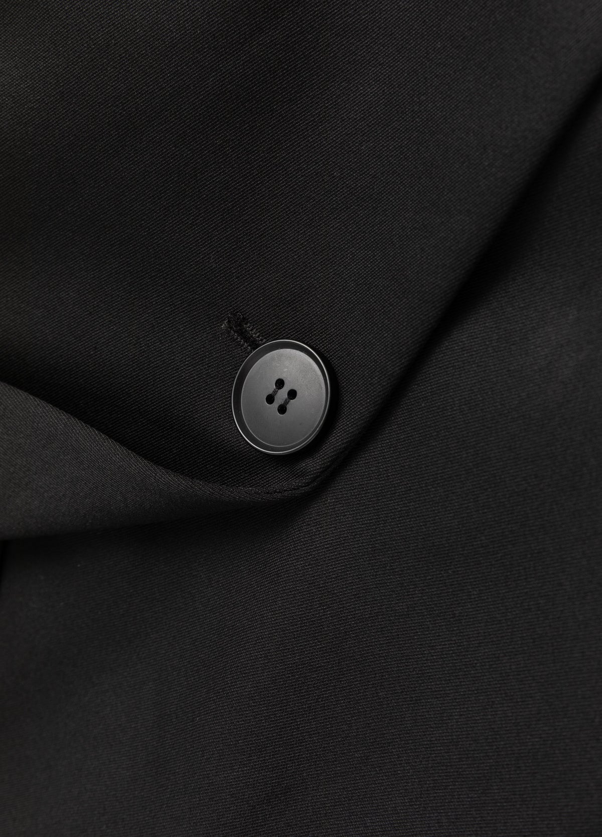 Single-button front fastening.