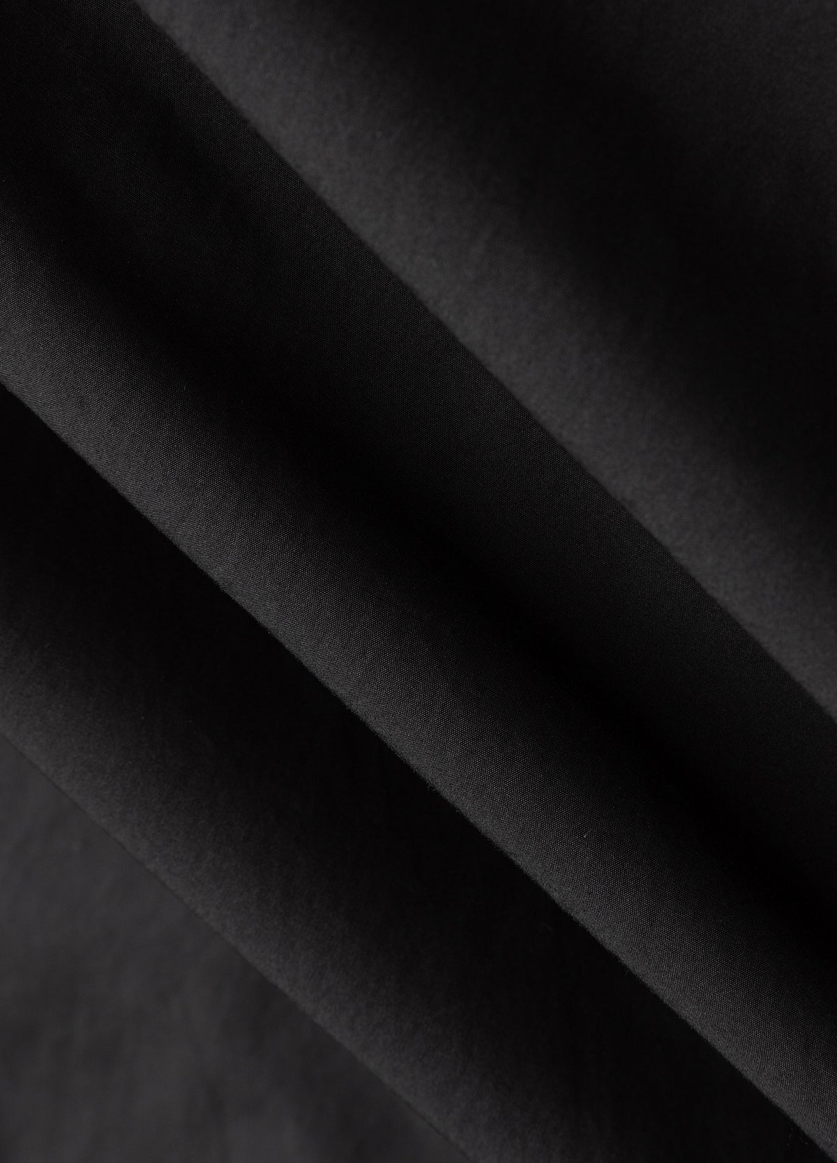 Black fabric surface.