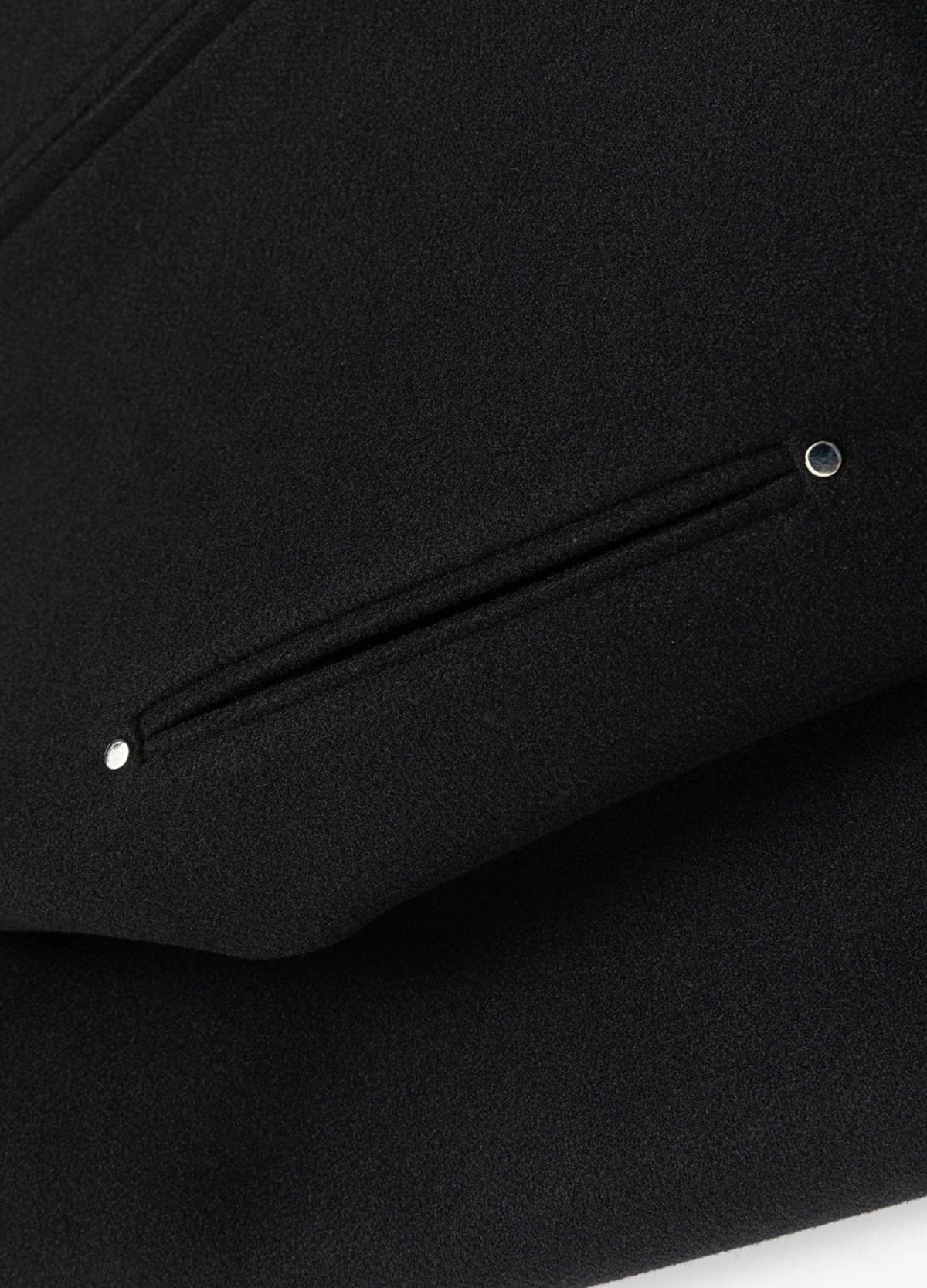 Welt pocket with metal end rivets.