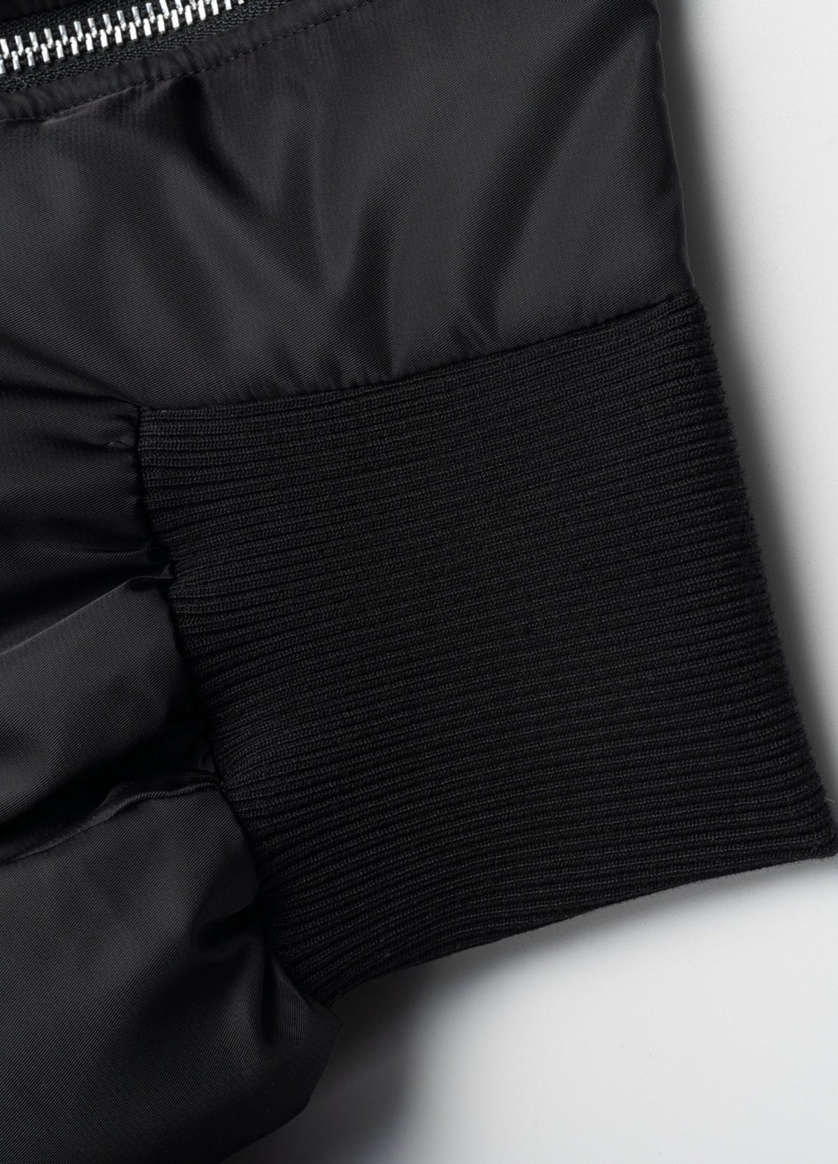 Wide rib-knit waistband.