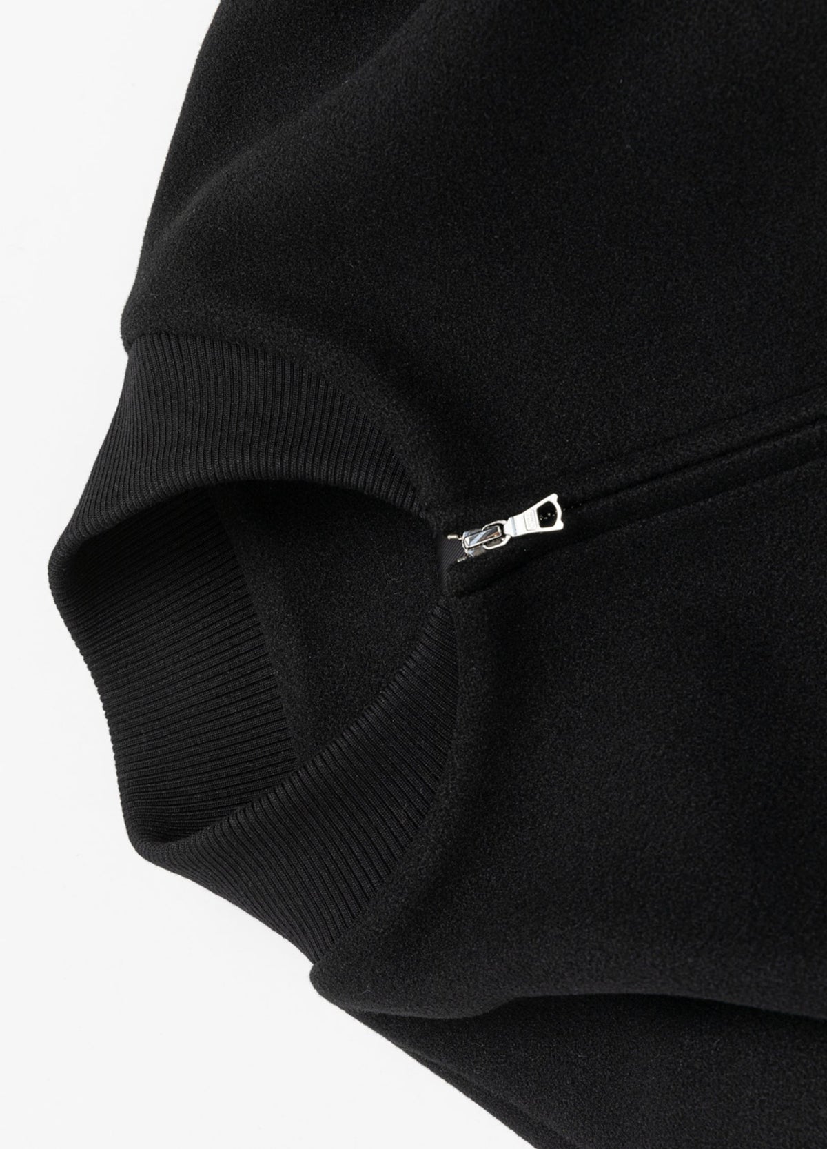 Rib-knit collar and zipper.