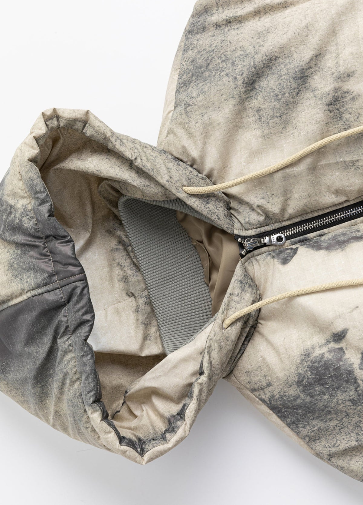 Hood, drawcord and zipper.
