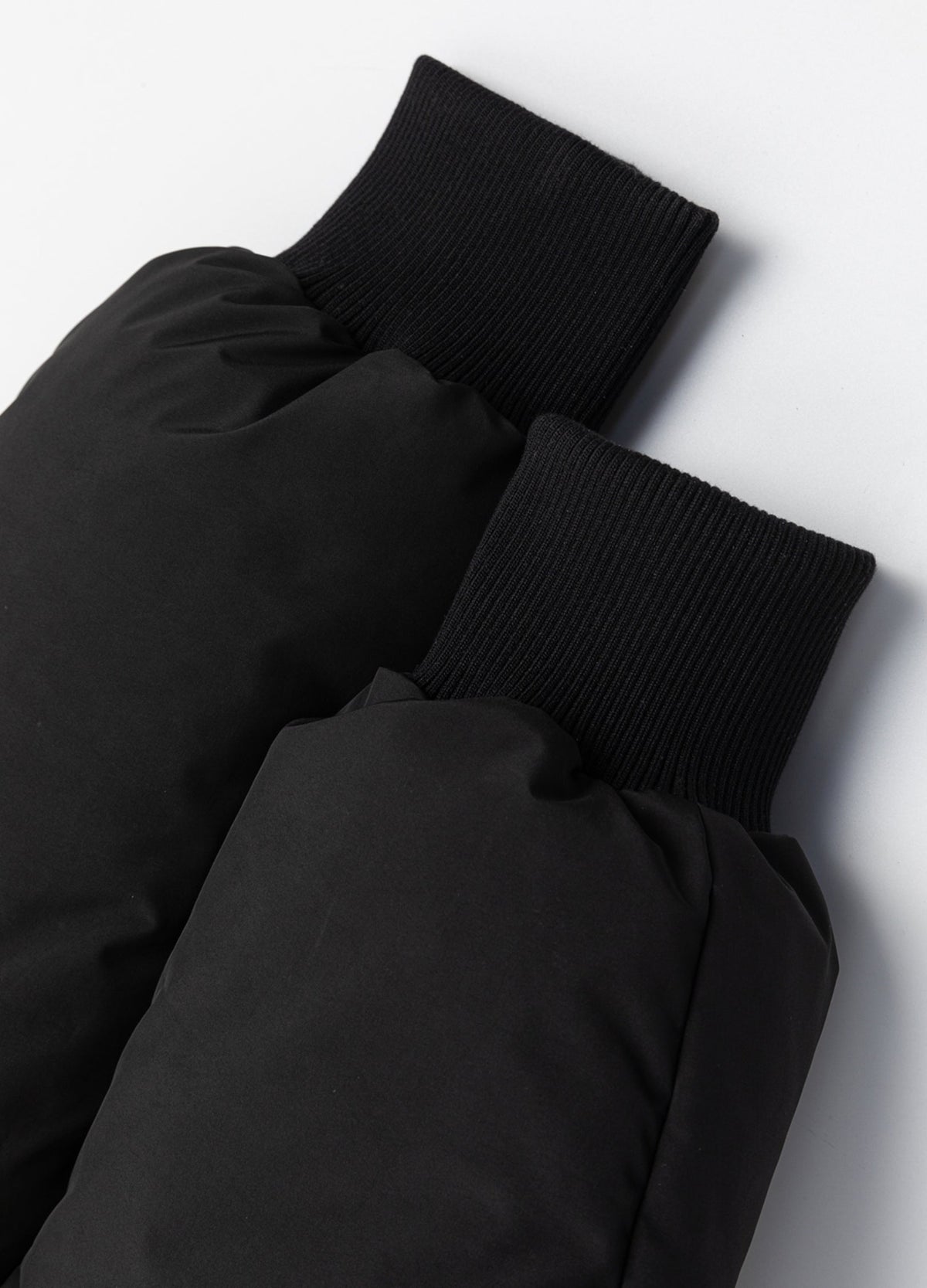 Rib-knit sleeve cuffs.