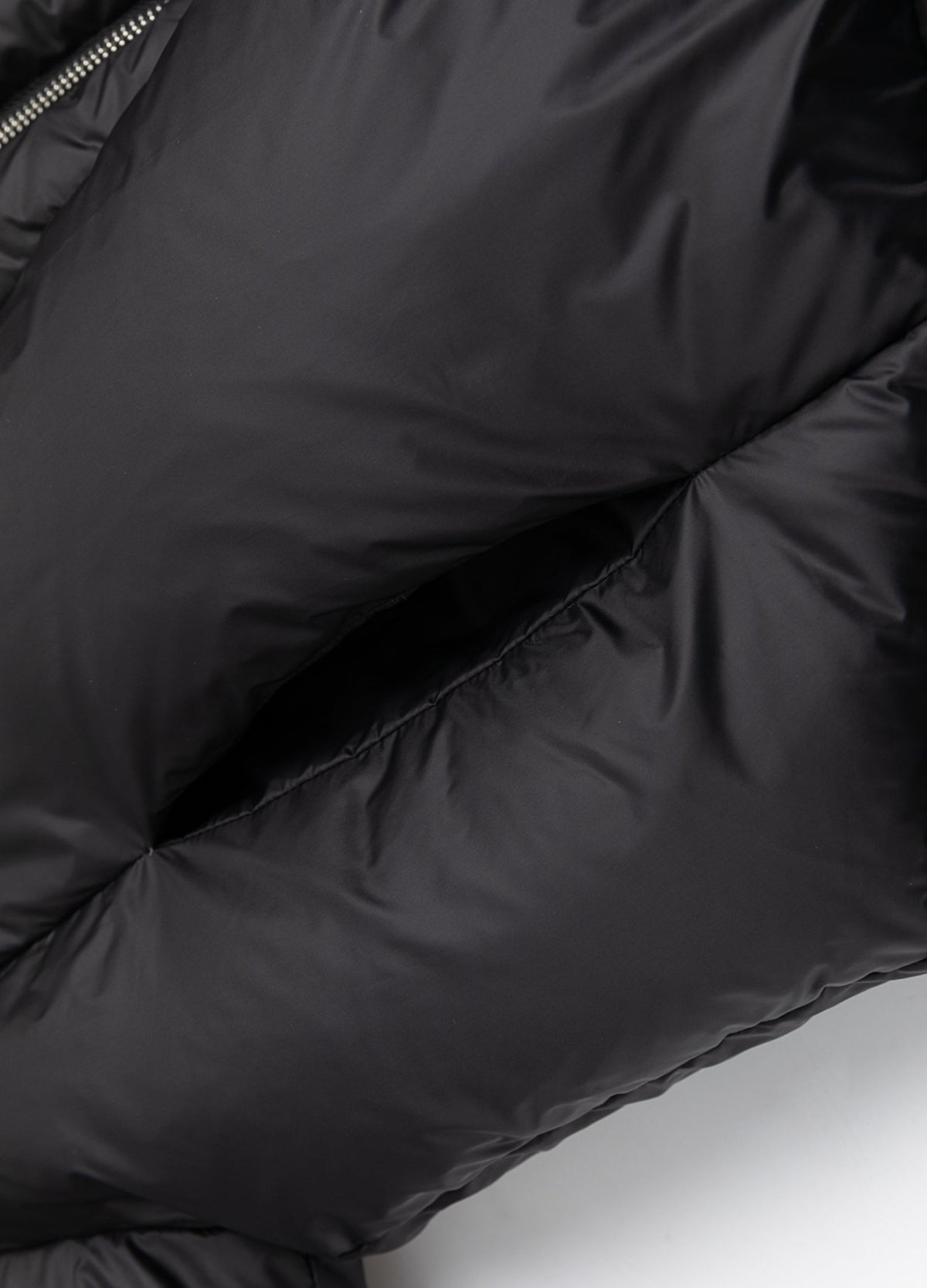Pocket opening within padded panel.