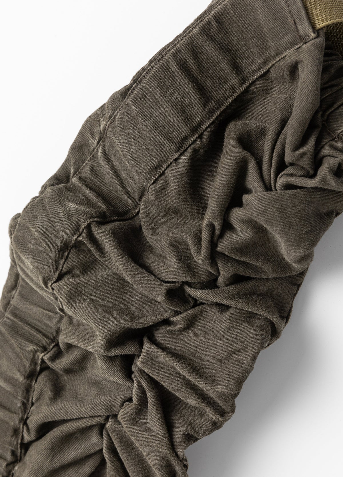 Gathered sleeve construction.