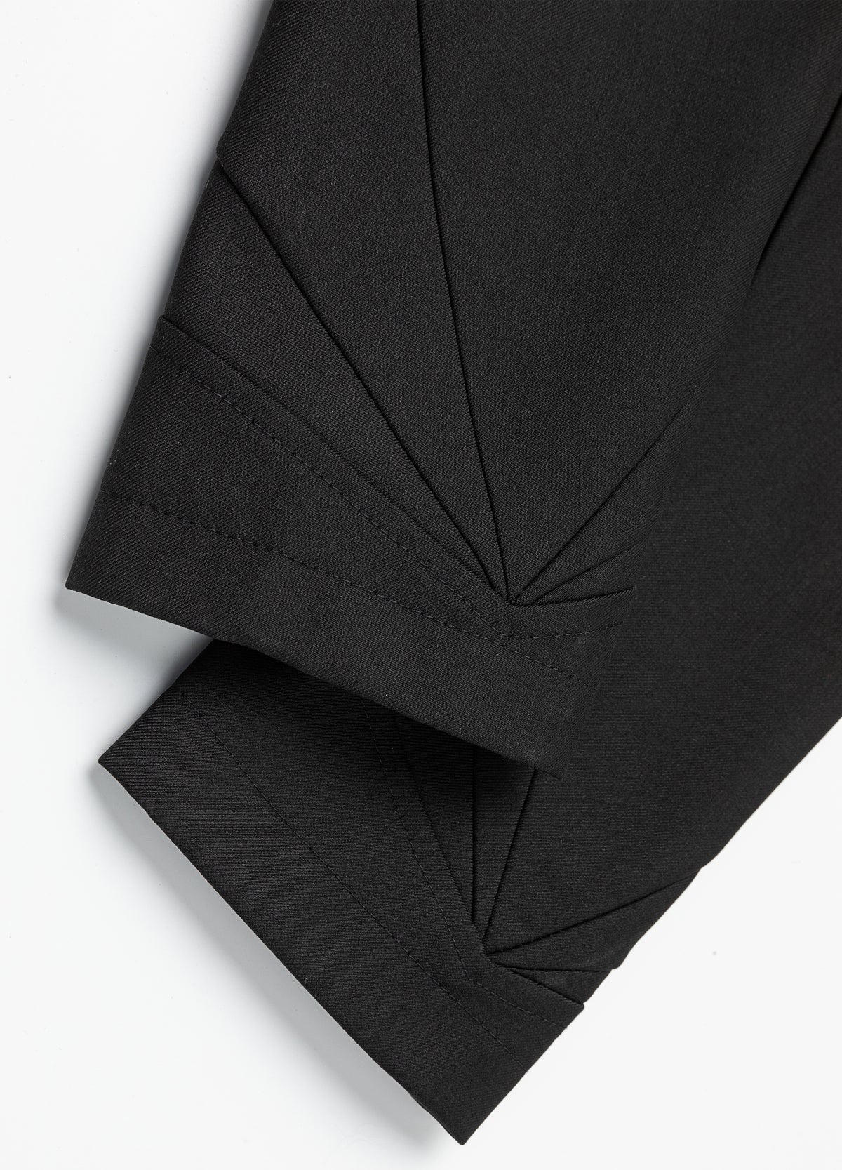Fan-shaped seam lines at the cuffs.