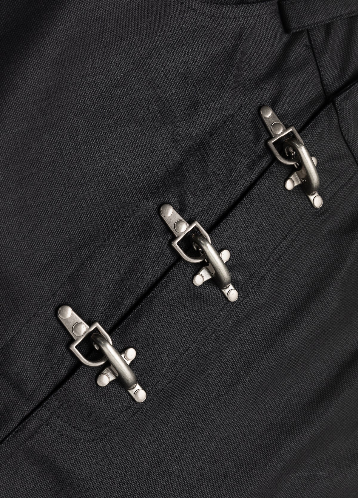 Three metal clasps across the front.