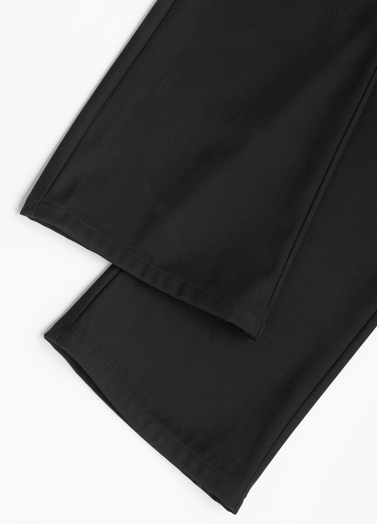 Hem edges and leg seam detail.