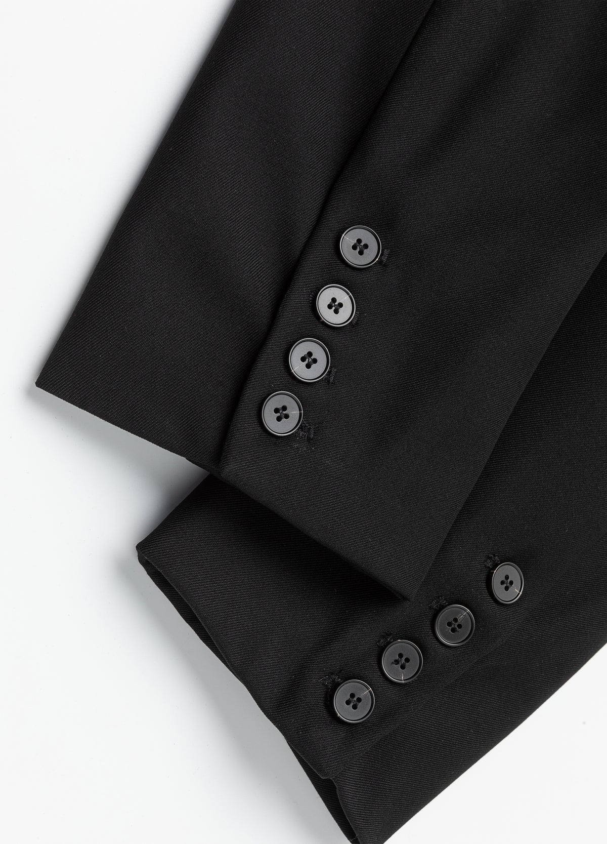 Four-button cuff detail.