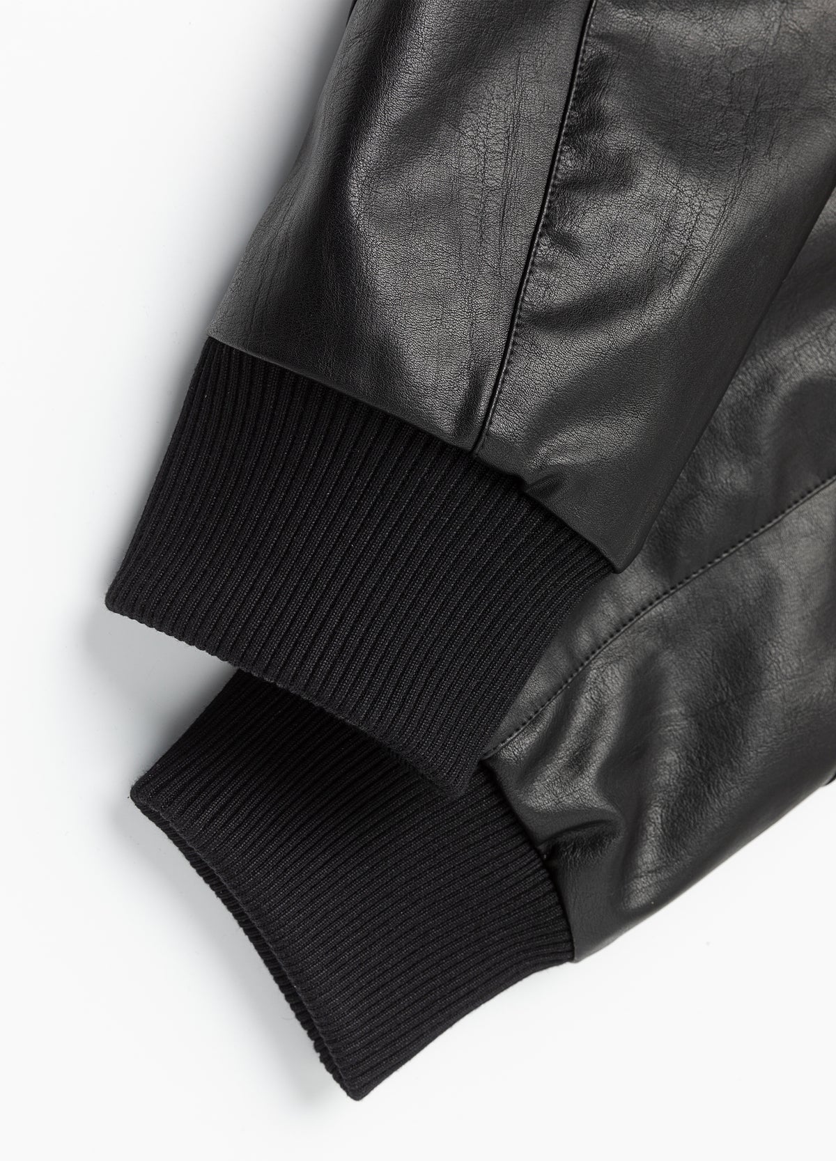 Ribbed cuffs at the sleeve ends.
