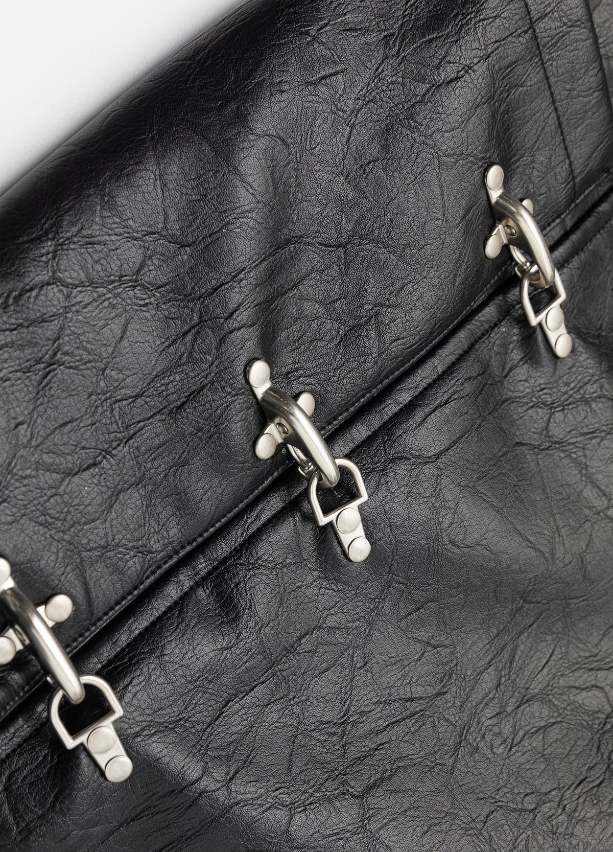 Metal clasps across the front.