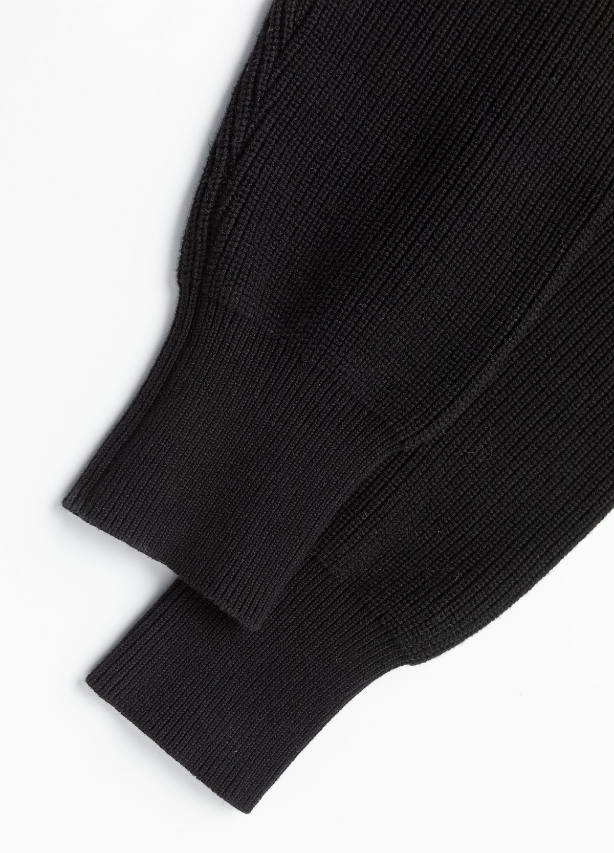 Ribbed cuffs and sleeve transitions.