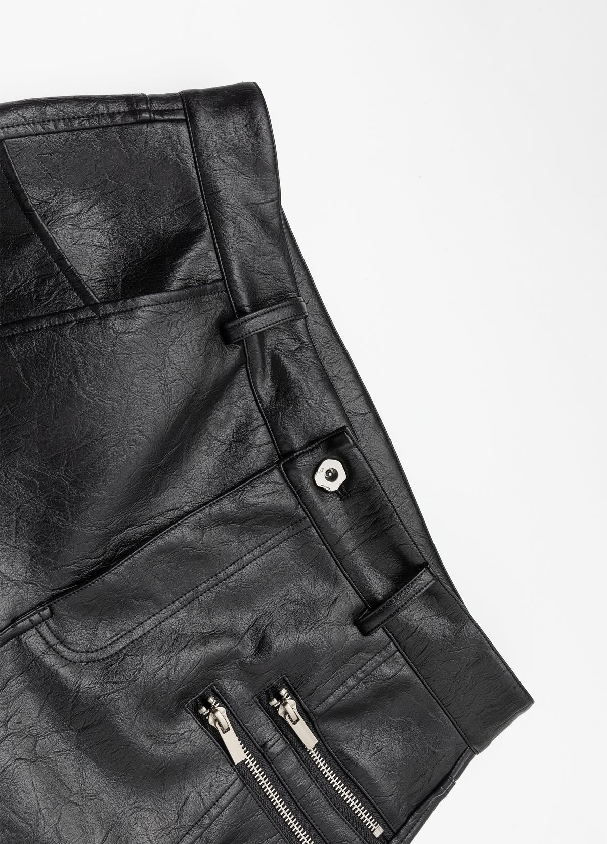 Waistband and zipped pocket openings.