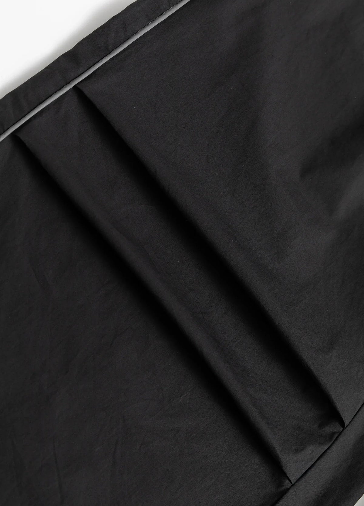 Folded knee panel and stitched seam.