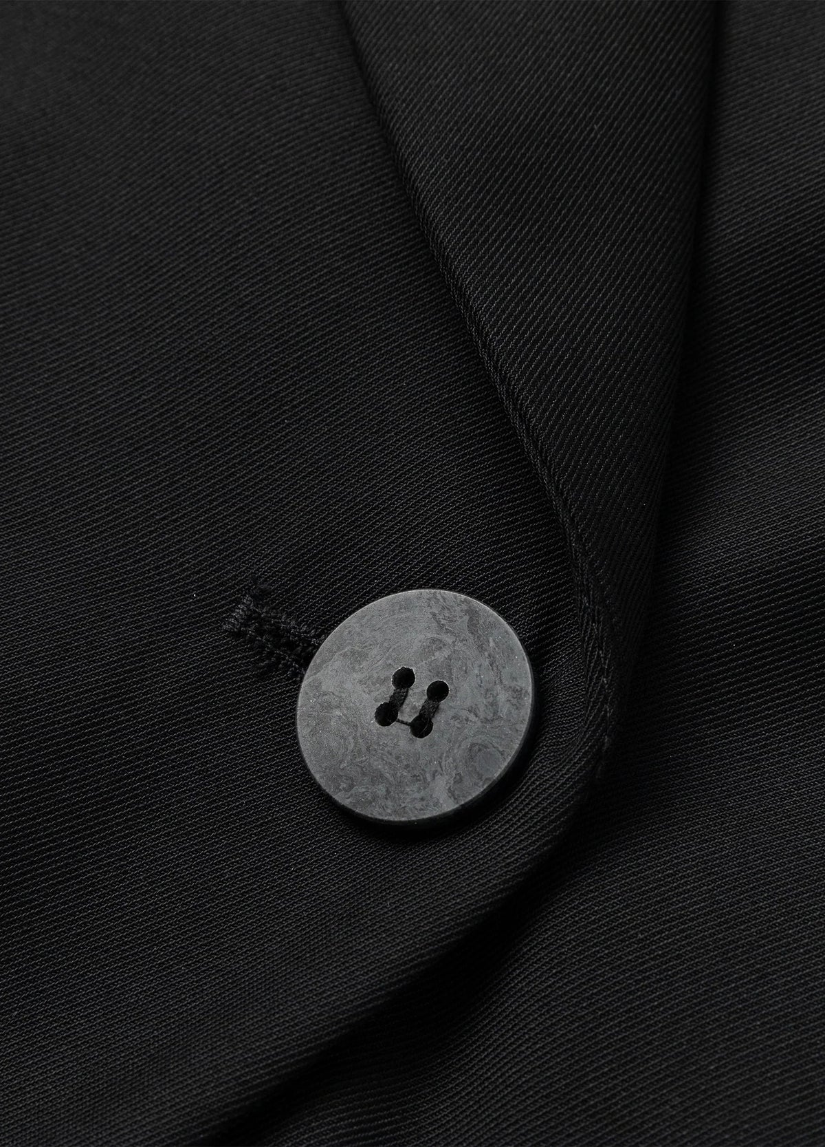 Offset front button.