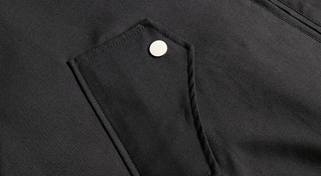 Angled pocket flap and snap fastening.