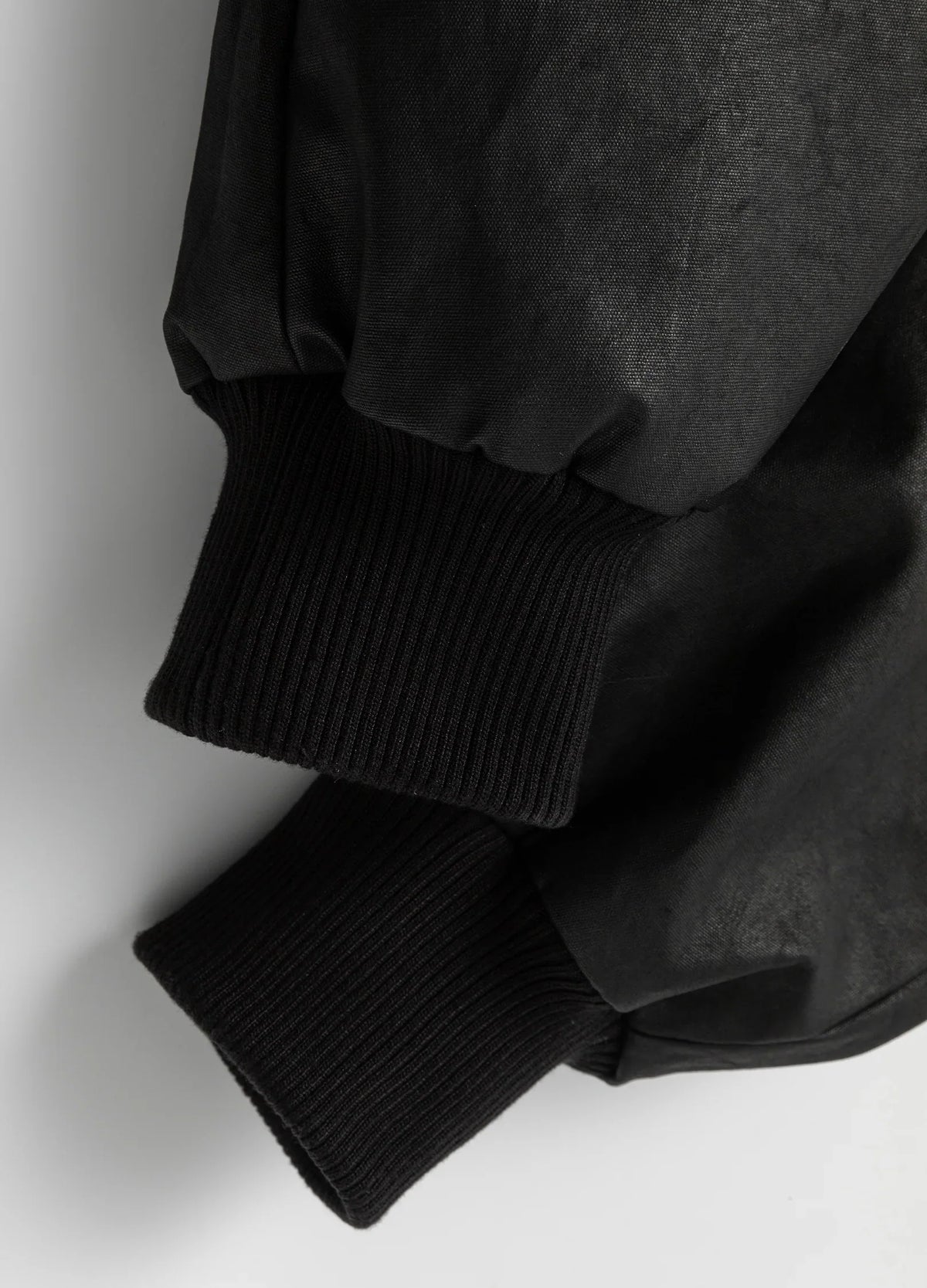Gathered sleeves meet ribbed cuffs.
