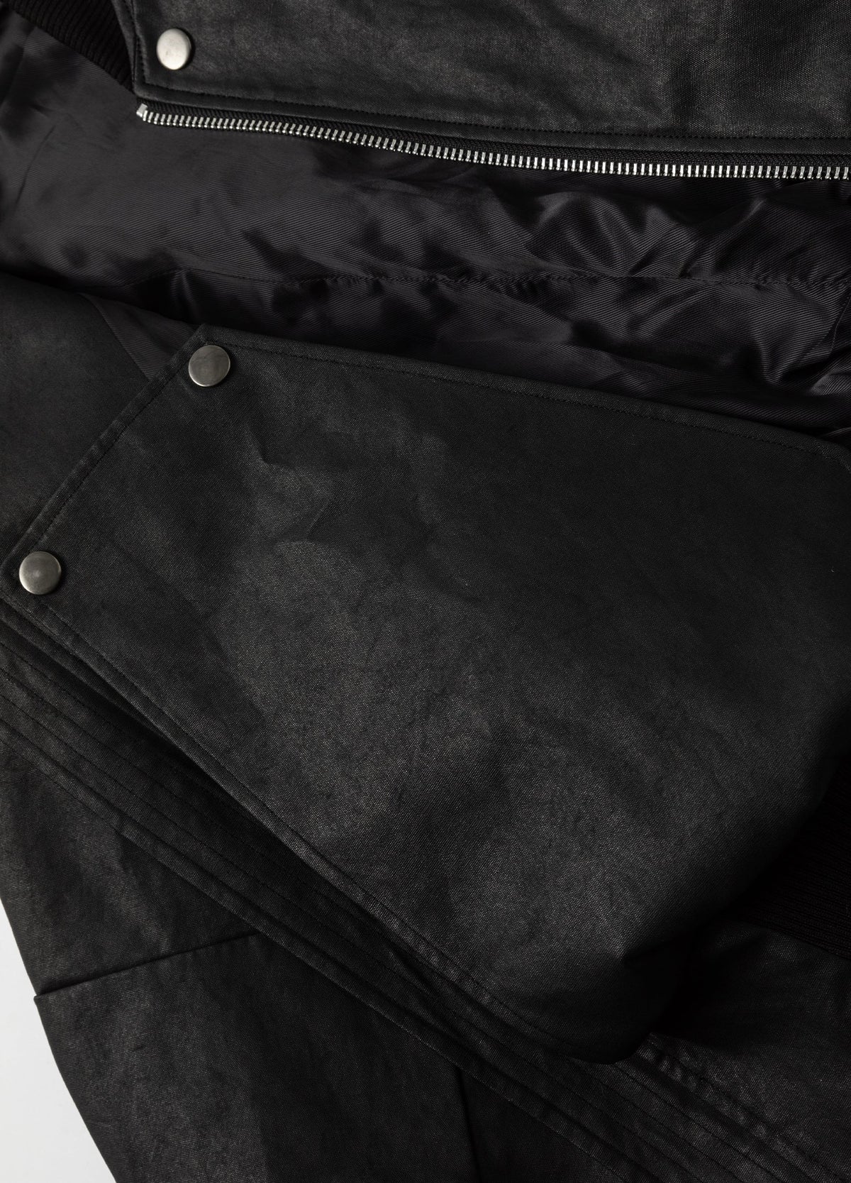 Interior lining and snap-fastened panel.