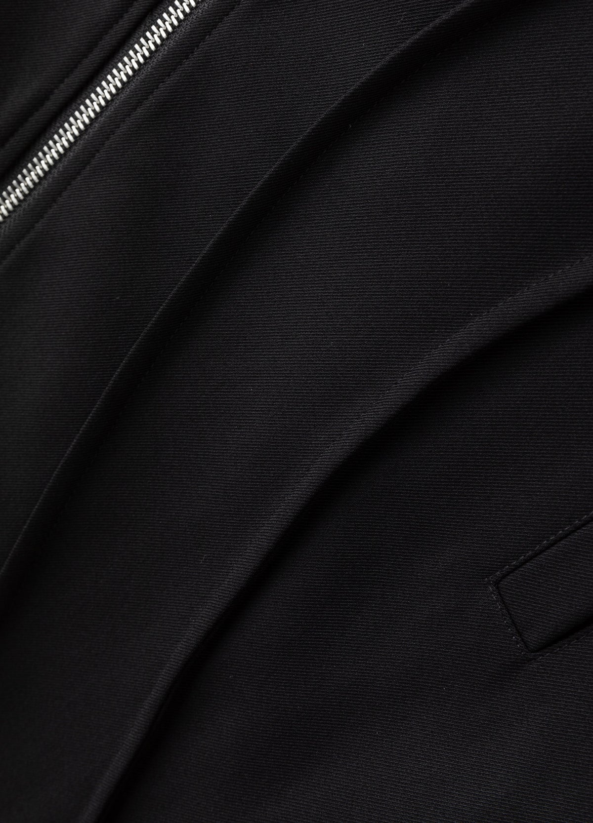 Fabric surface and raised curved seams.