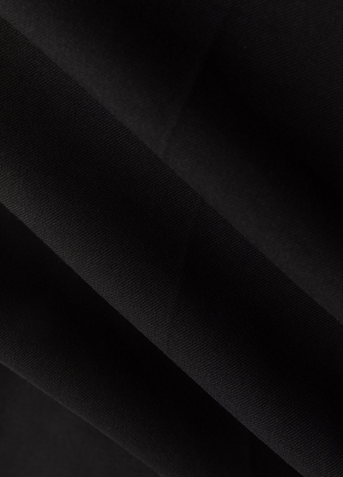Black fabric surface.
